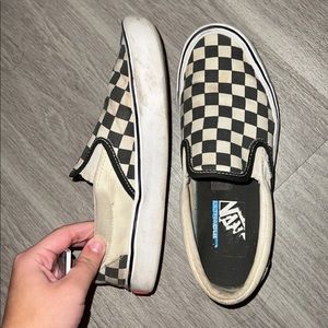 white and black checkered slip on vans